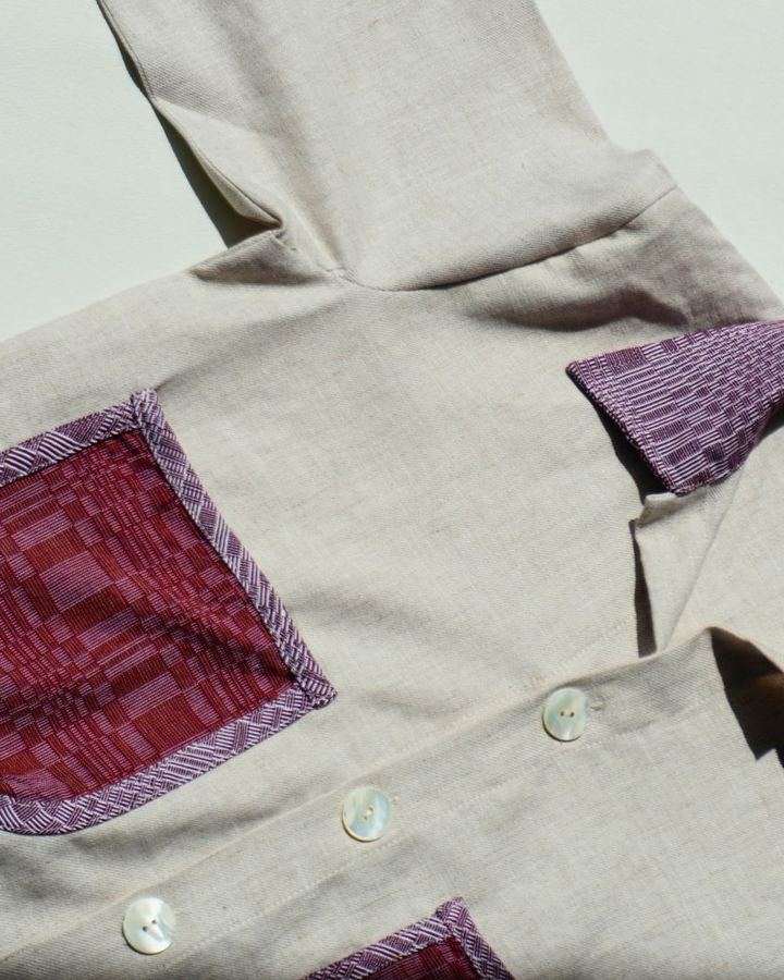Cream linen jacket with Binakol pocket and collar, laid flat
